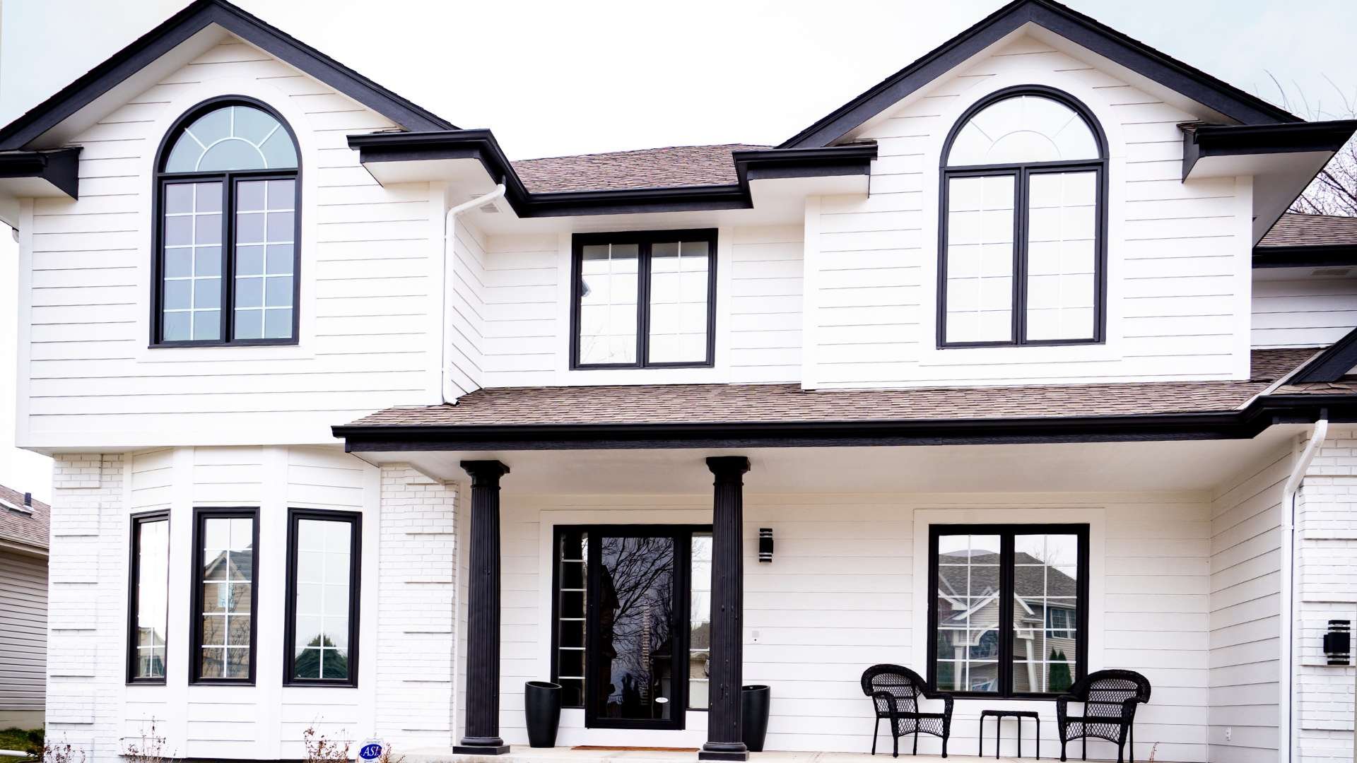 White exterior of home with black trim.